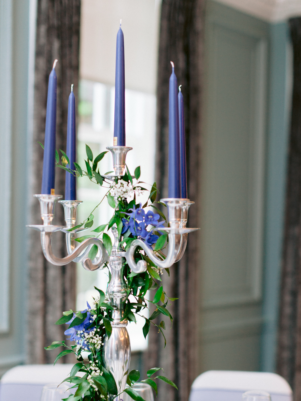 Blue candle sticks in the dining room tables ready for the wedding breakfast at Gorse Hill Wedding venue
