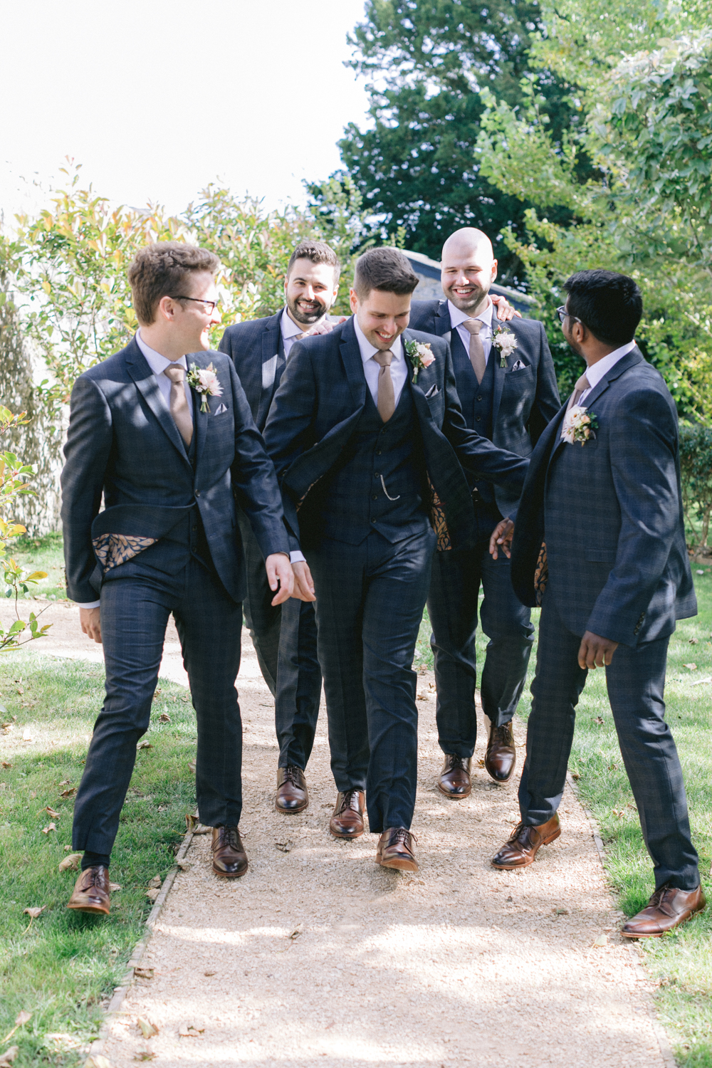 The groom and his groomsmen get ready for the wedding ceremony
