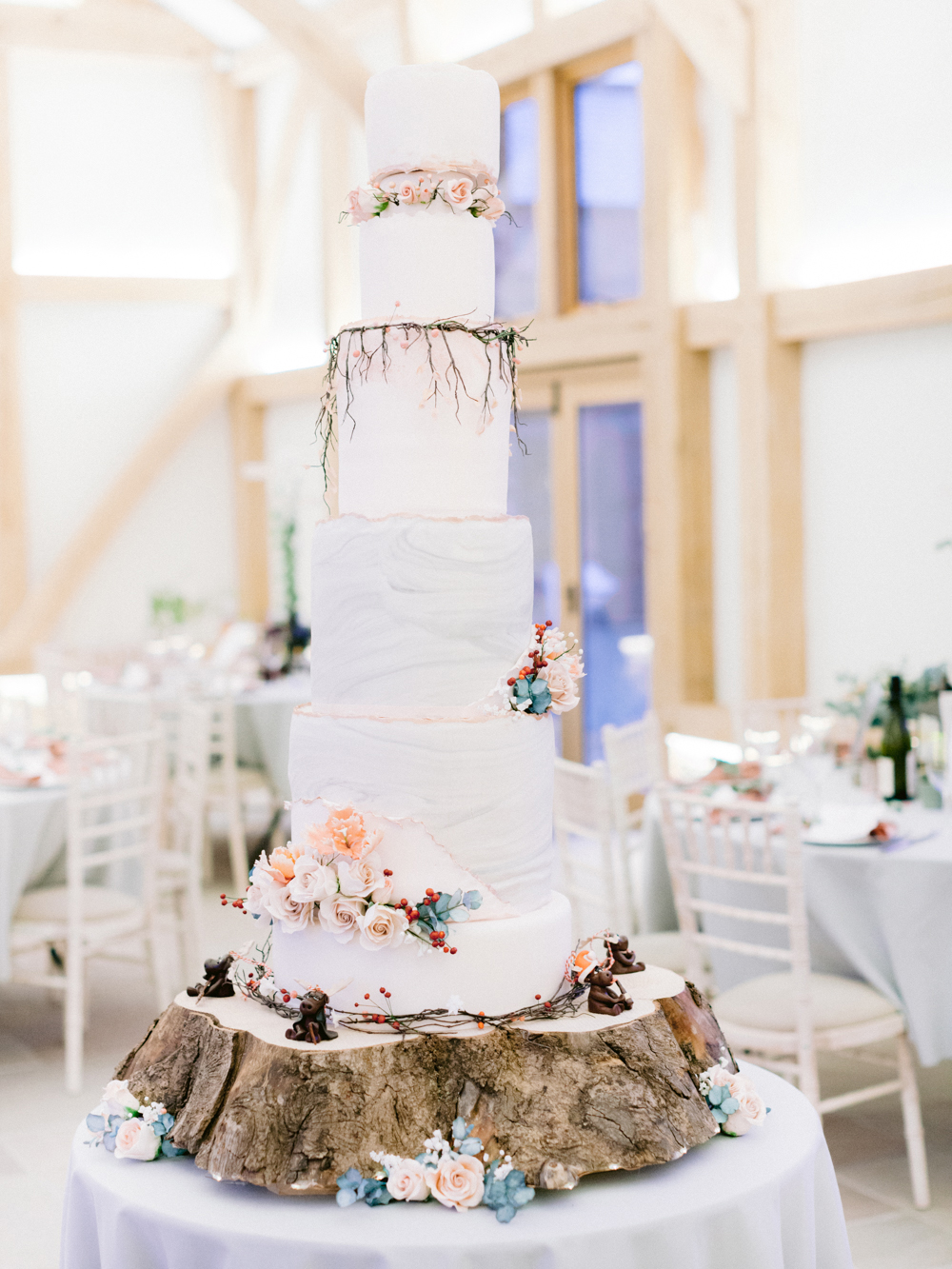 Romantic 5 tiered homemade white wedding cake with Moose animal decorations