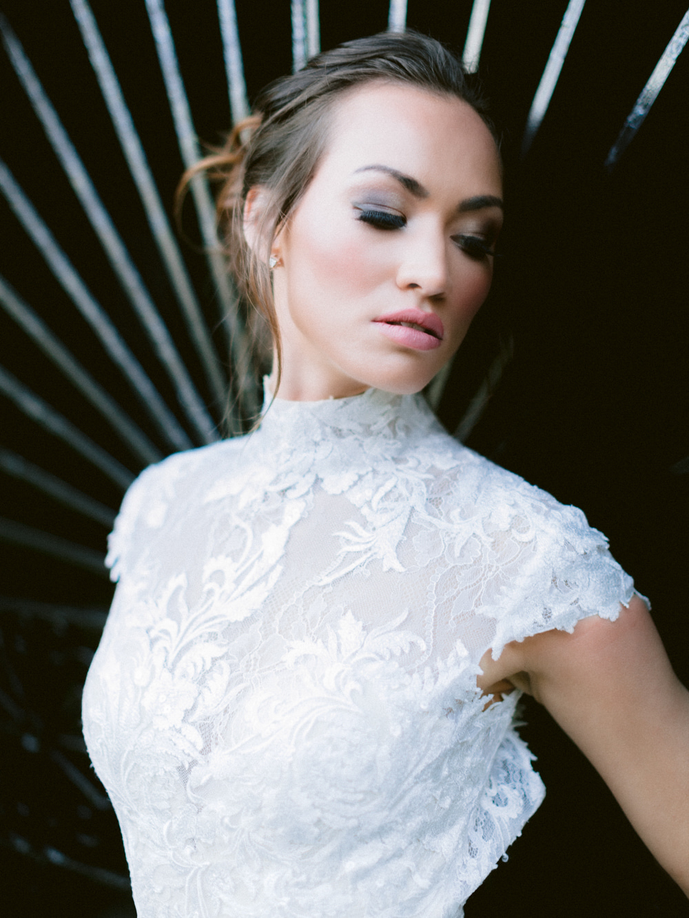 Close up of model wearing lace style gown by Dando London