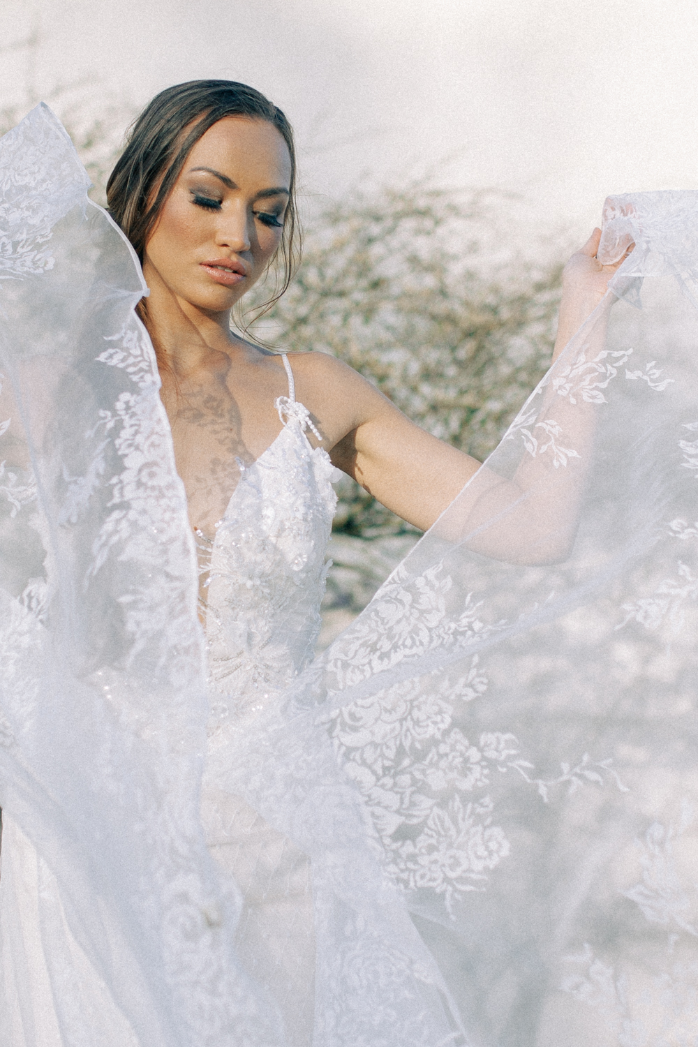 Beautiful lace Riki Dalal Couture Wedding Gown on model in sunshine