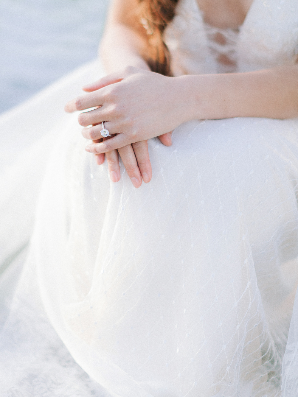Engagement ring by Laing against lace Riki Dalal Wedding dress