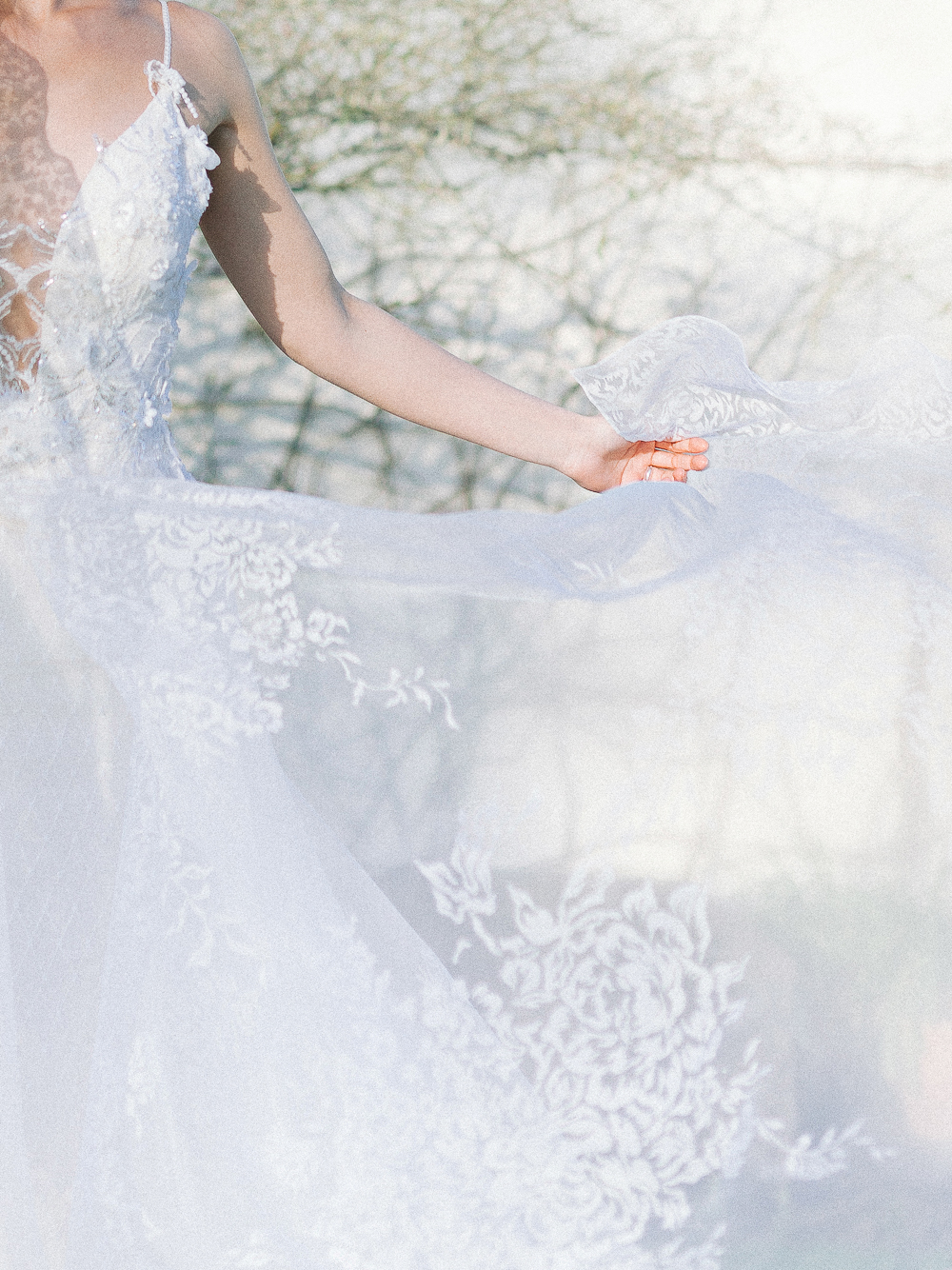 Close up of oh-so-dreamy wedding dress floating in the wind