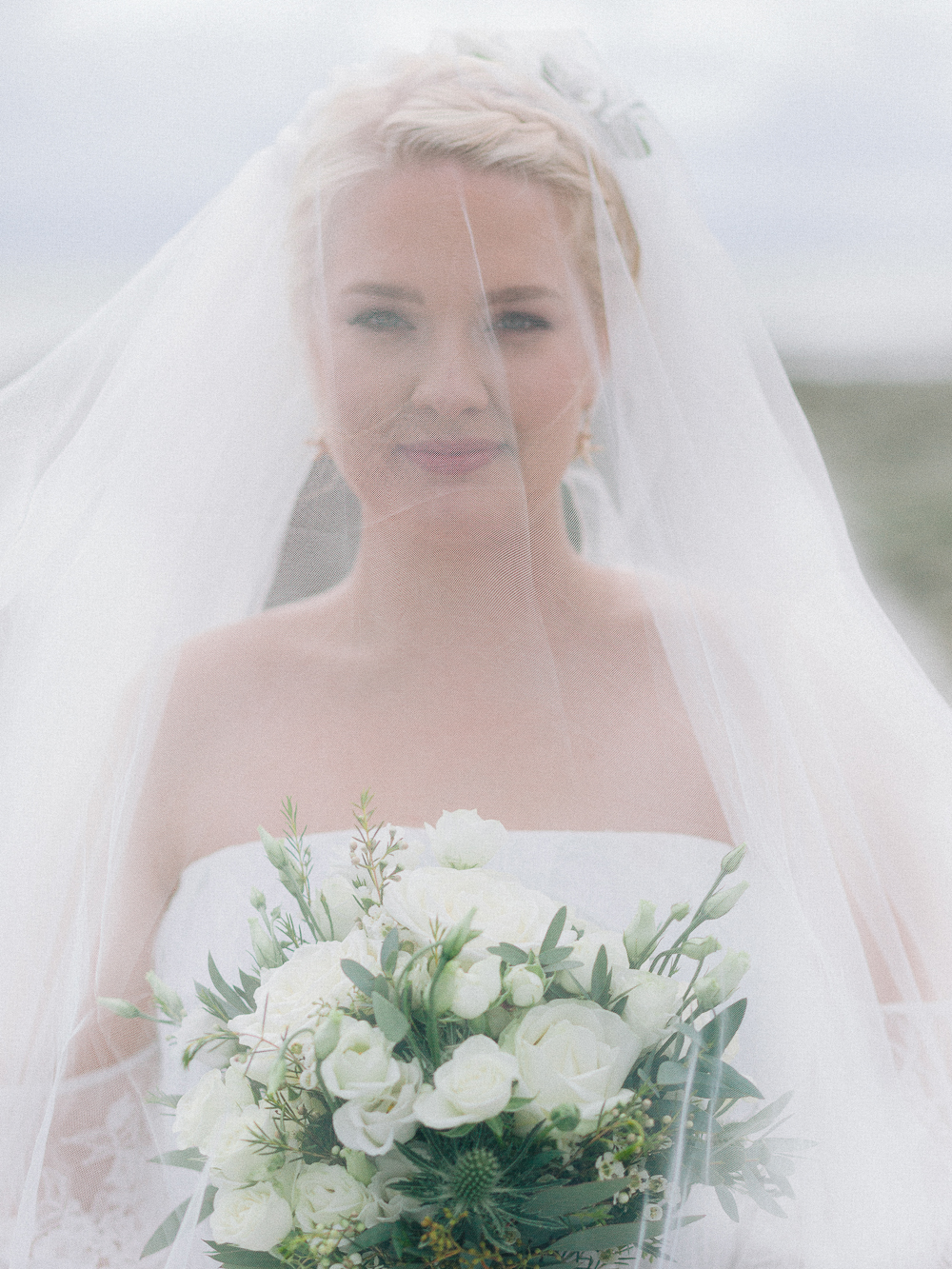 Pretty image of Bride with her veil covering her face at Rosedew Farm