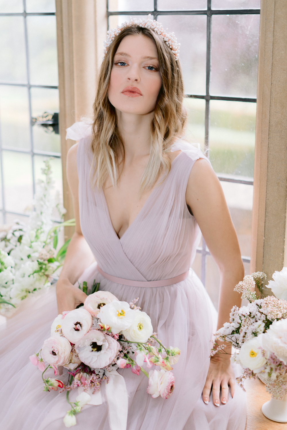 Dreamy fairytale flowers with bridesmaid wearing lilac blush gown