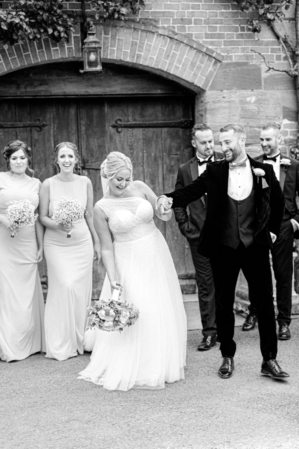 Bride and Groom take romantic stroll at Brinsop Court