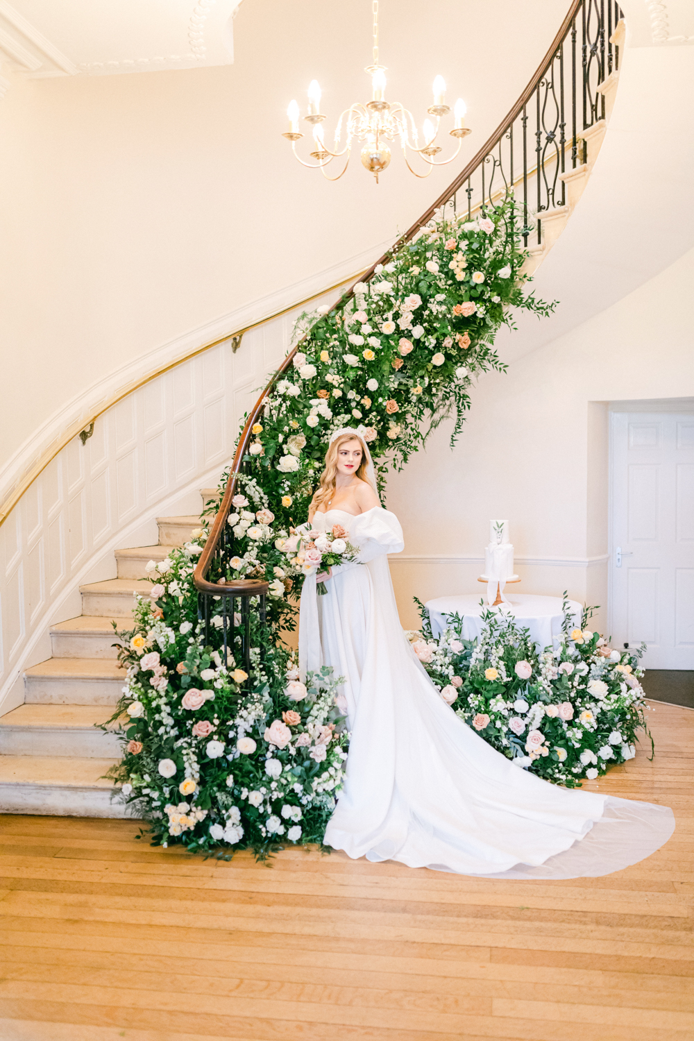 Luxury Wedding flowers adorn the whole staircase at Eastington Park