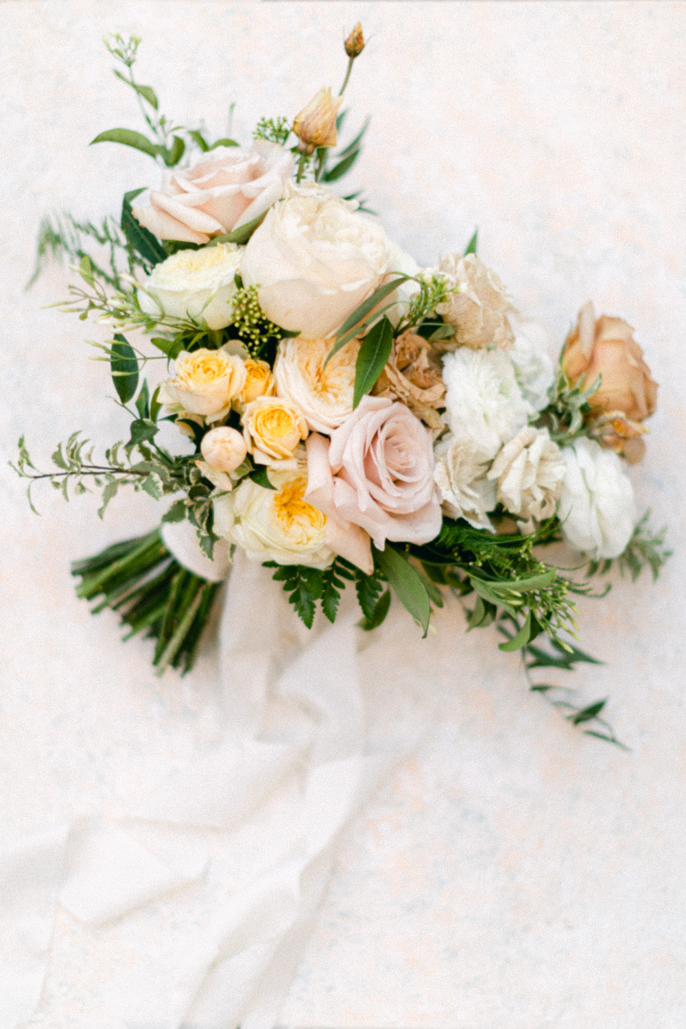 Luxury Wedding flowers of pink yellow and blush peonies at Eastington Park