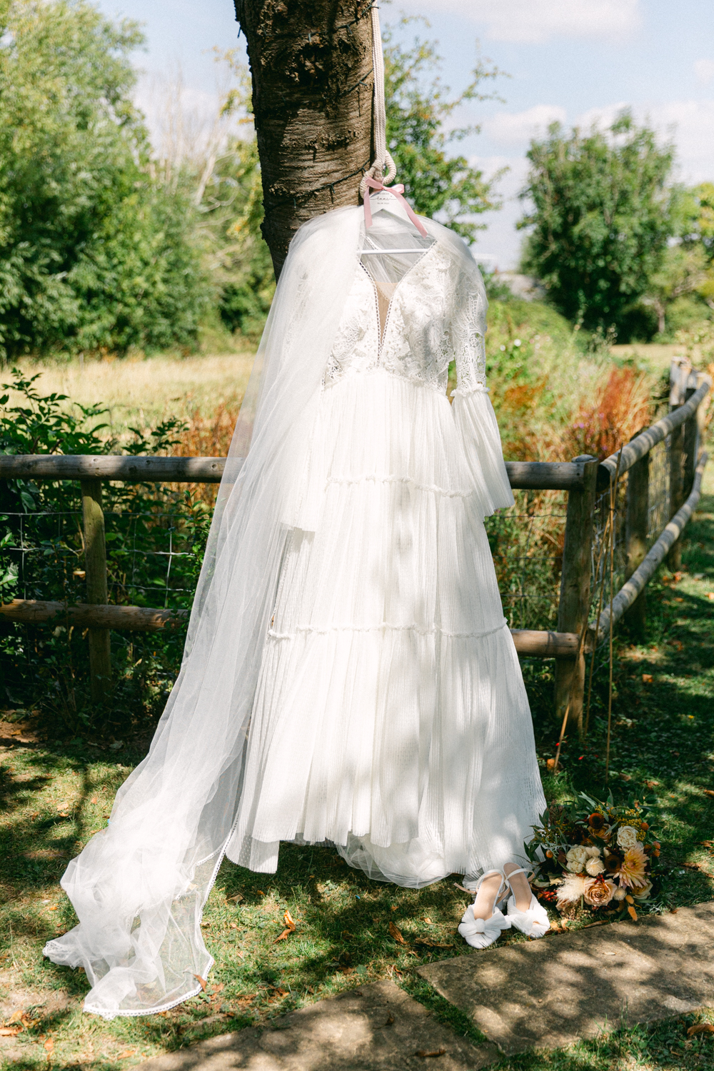 Wedding dress hanging from a tree