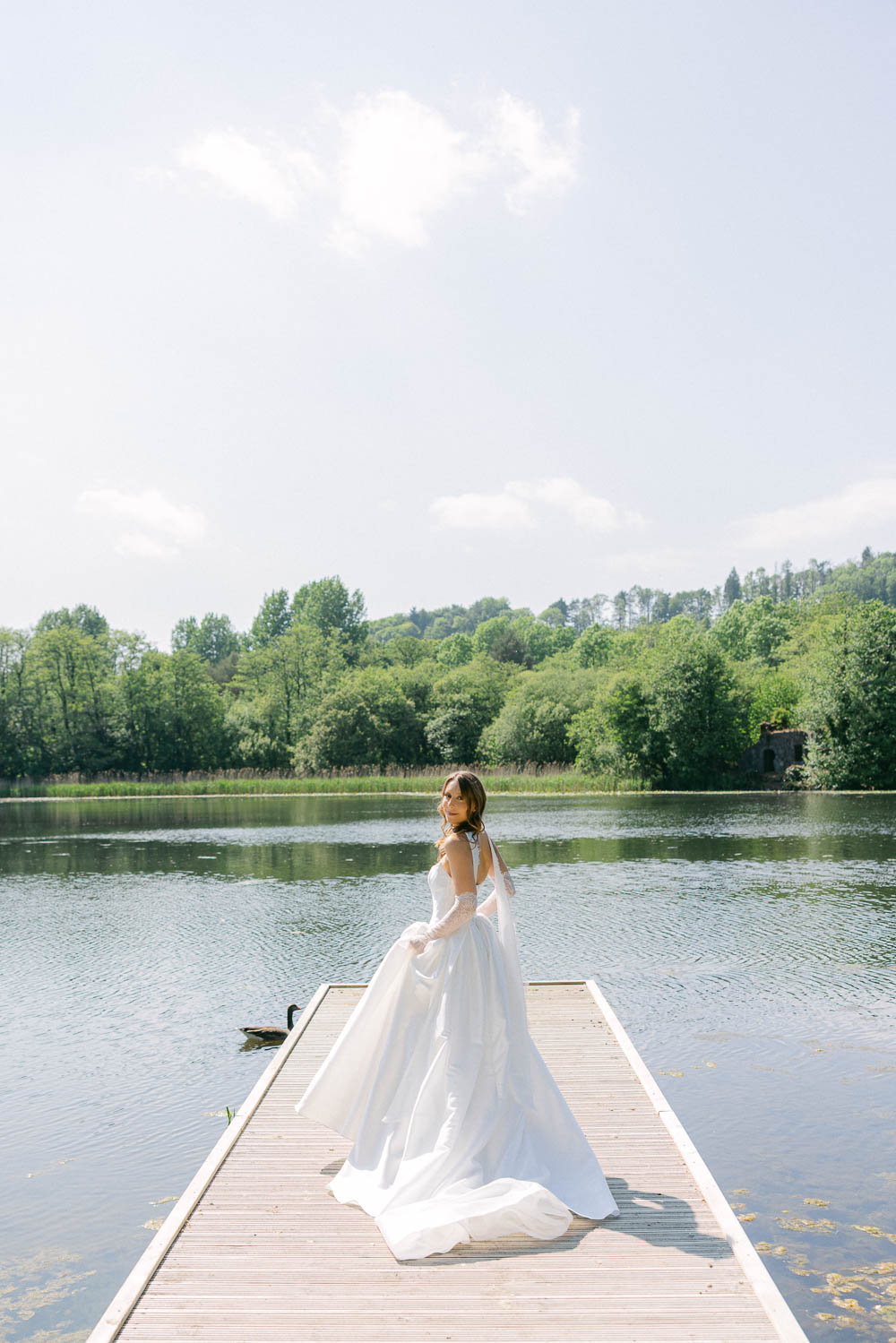 Bride at the lake Hensol Castle Wedding