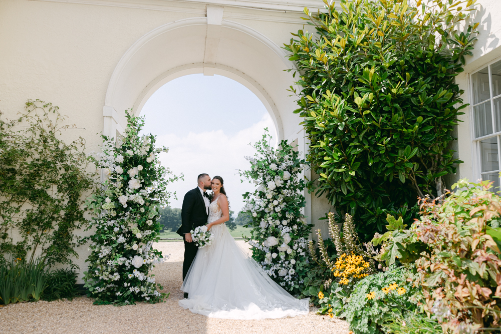 Luxury Floral Wedding at Rockbeare Manor Luxury Arch made of sick flowers at Rockbeare Manor