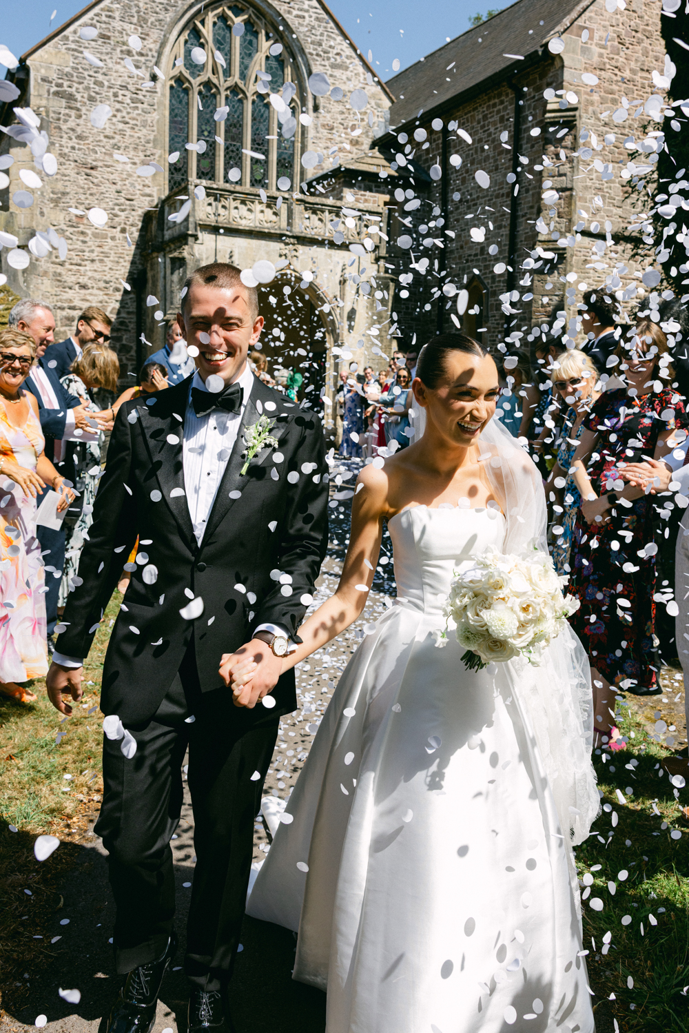 Llantilio House Wedding Photographer - Confetti outside USK Church