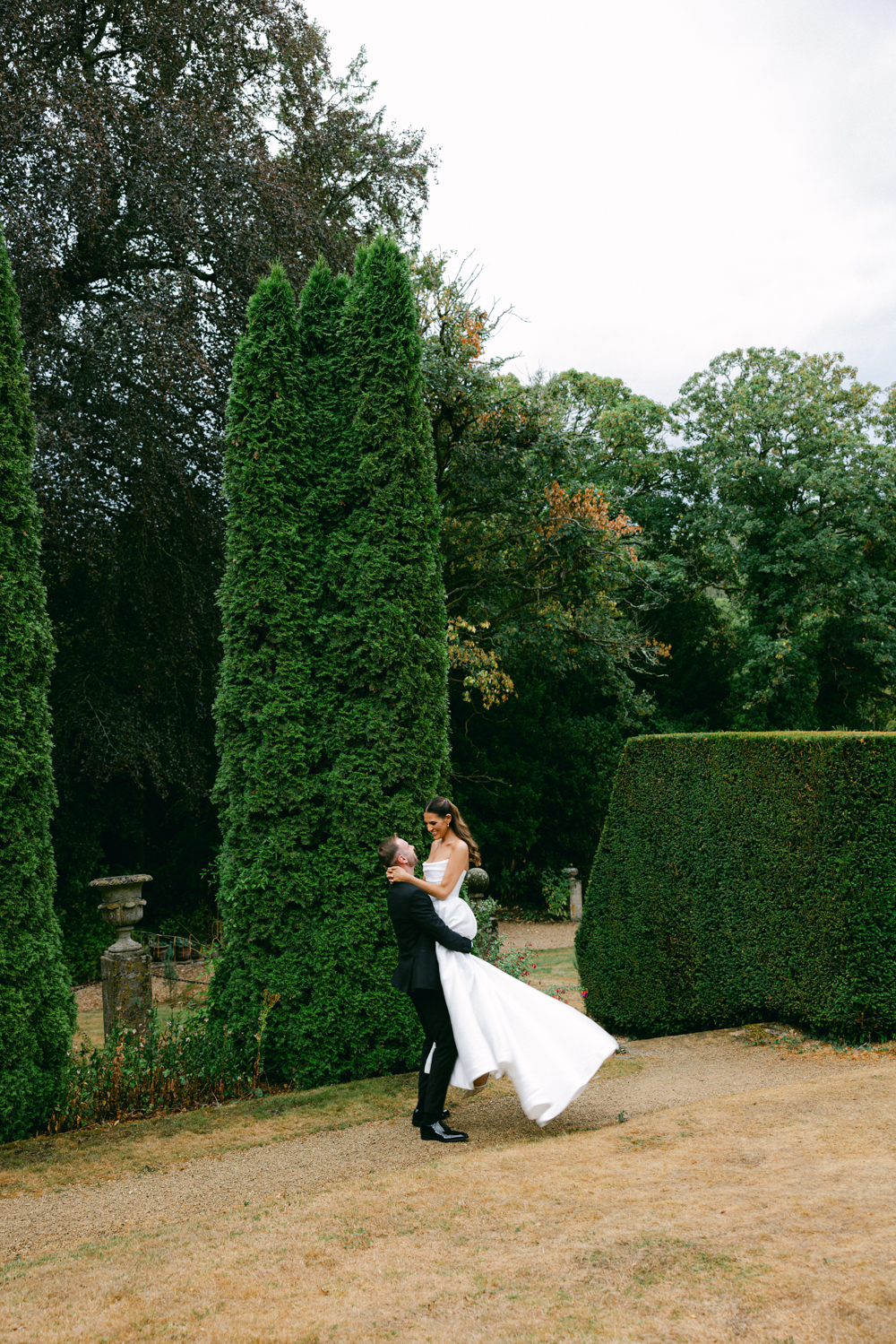 Bride and Groom in the Italian Gardens at the Cotswolds Manor House