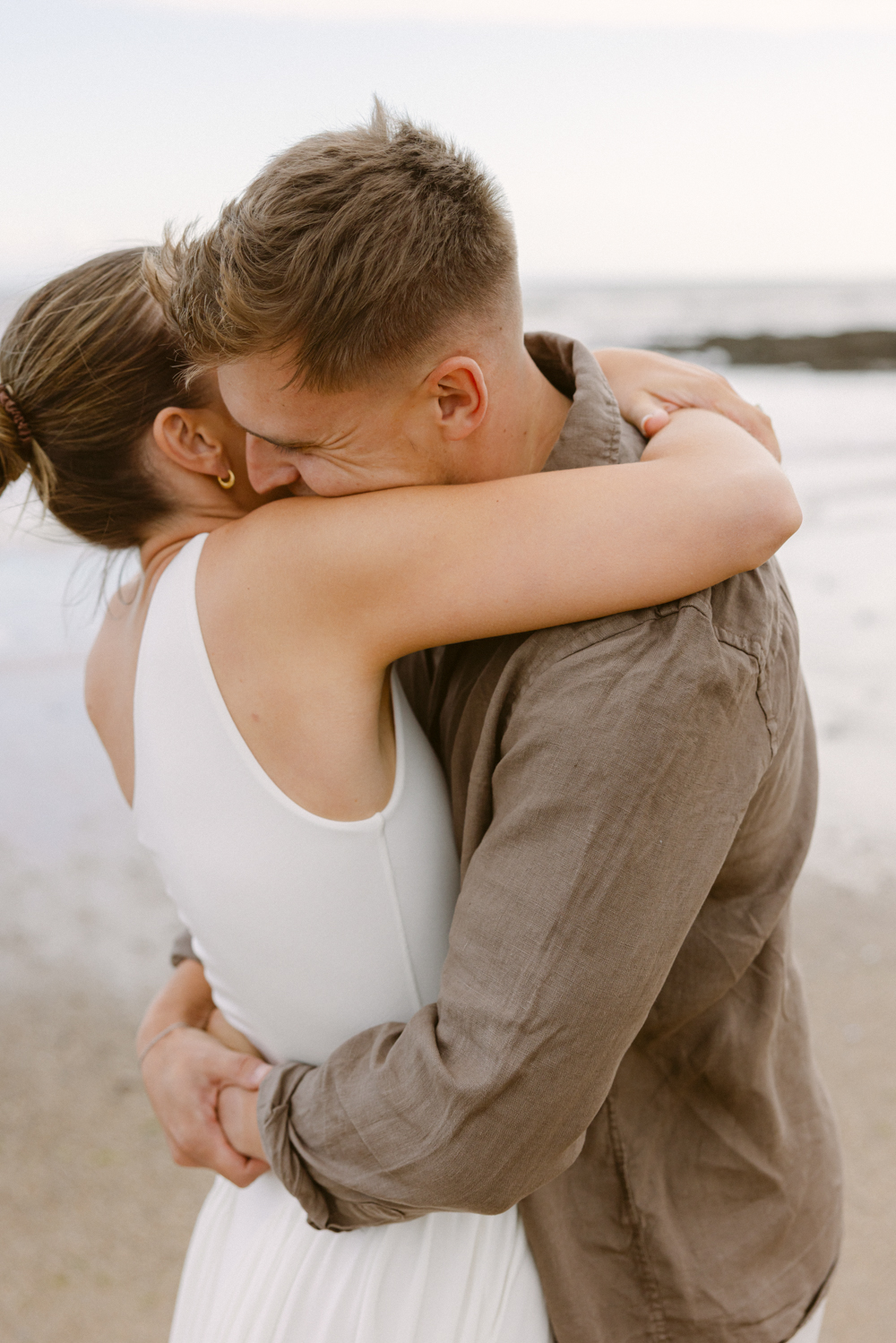 Charlotte and Sam’s relaxed Newton Beach engagement session in Porthcawl, photographed by South Wales wedding photographer Aurelia Allen.