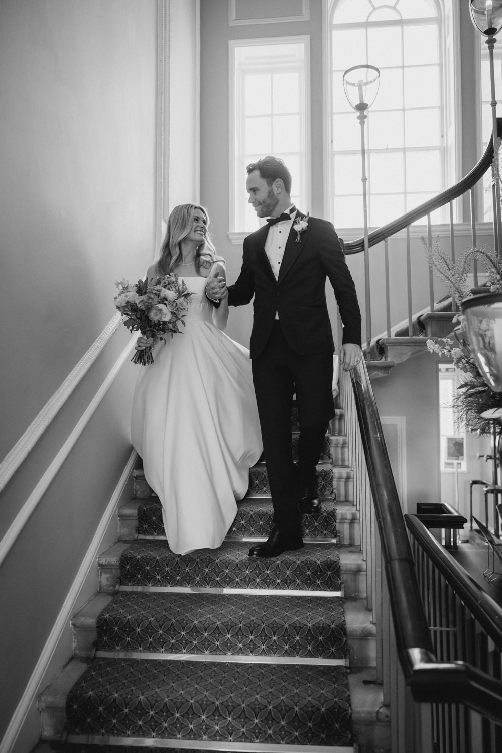 Bride and groom walking down staircase at The Royal Crescent Hotel Bath wedding